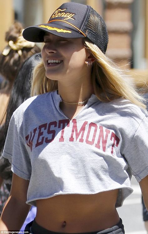 Worth studying: She showcased her taut tummy by wearing a cropped Westmont College T-shirt Cropped College Shirt, T Shirt Cuts Diy, College Tee Outfit, College T Shirt Outfit, Shirt Cropping Ideas, Cute College Shirts, Cropped T Shirt Diy, Cute Way To Cut A Tee Shirt, Diy College Shirts