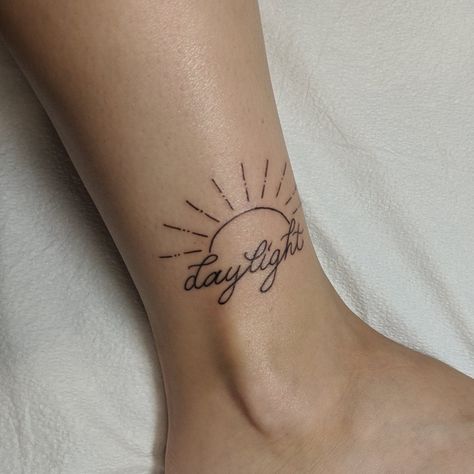 Daylight tattoo with sun rays Sun And Name Tattoo, Sun Name Tattoo, Sun Tattoo With Name, Taylor Swift Tattoo Daylight, Daylight Tattoo Taylor Swift, Taylor Swift Daylight Tattoo, Daylight Taylor Swift Tattoo, Ray Of Sunshine Tattoo, Rays Of Sunshine Tattoo