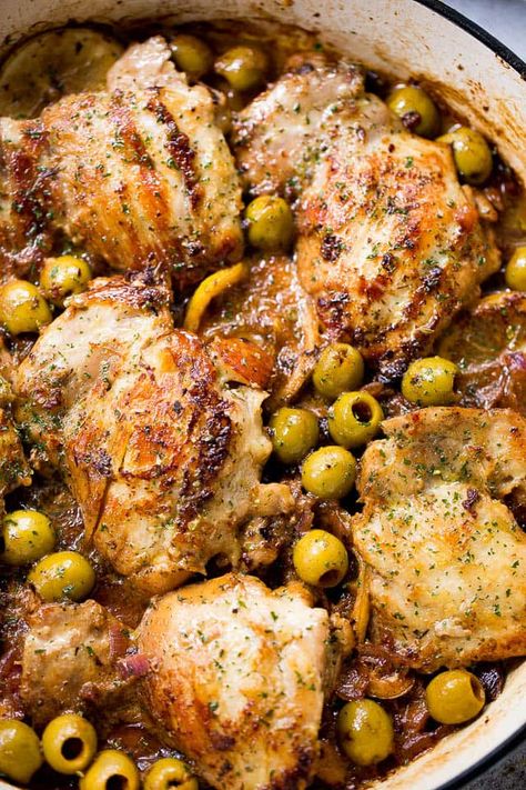 Saucy Skillet Chicken with Lemons and Olives - Delicious pan seared chicken thighs prepared with olives, lemons, and red wine.