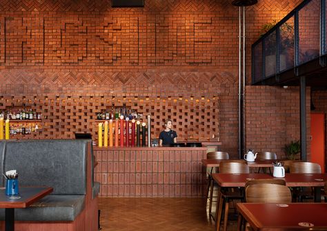 Red Brick Interior, Brick Bar, Restaurant Bar Design, Upholstered Banquette, Brick Interior, Bar Design Awards, Oak Wood Floors, Hospital Interior Design, Drinks Design