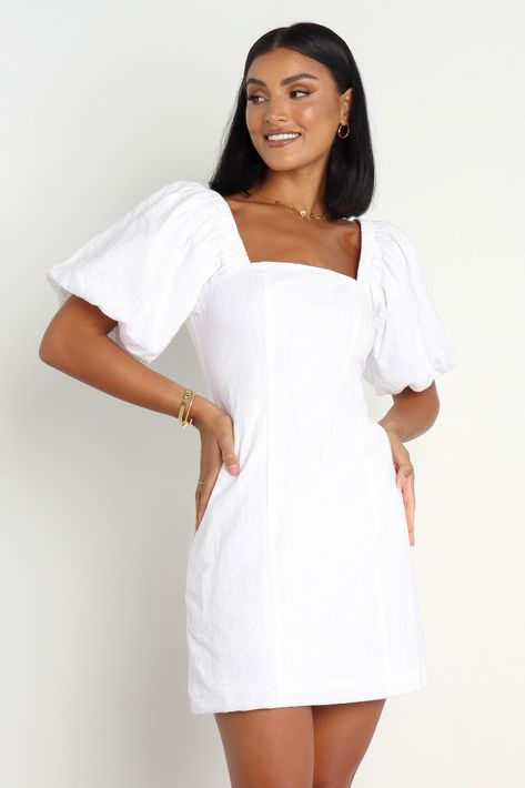 DETAILS above knee length square neckline short sleeves with elasticised cuffs elasticised shoulders back invisible zip back shirred panel unlined material - 100% cotton SIZING model is 170cm and wears a size 8 model stats: bust - 81cm, waist - 64cm, hips - 92cm GARMENT CARE cold hand wash separately