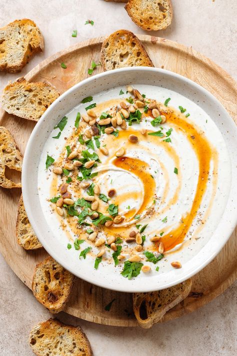 Enjoy the unique flavors of whipped feta dip with a spicy-sweet kick of hot honey. Perfect for parties and gatherings, our dip is made with the freshest ingredients, including creamy feta cheese, goat cheese, garlic, and a generous drizzle of hot honey. Serve with your favorite crackers, pita chips, or crudites for a delicious and delightful appetizer. Feta Hot Honey Dip, Litha Recipes, Whipped Feta Dip, Goat Cheese Dip, Whipped Goat Cheese, Creamy Feta, Fall Appetizers, Feta Dip, Cream Cheese Dips