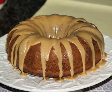 Learn how to make a pear cake recipe like this recipe for fresh pear bundt cake with creamy vanilla glaze. Combine ingredients in a mixing and pour into a prepared bundt pan. Bake for 1 hour and 15 minutes. Combine ingredients for glaze; drizzle over top of cake. Peanut Butter Pound Cake, Pear Cake Recipes, Cream Cheese Bundt Cake, Spiced Applesauce, Chocolate Chip Bundt Cake, Apple Cream Cheese, Butter Pound Cake, Pear Cake, Applesauce Cake