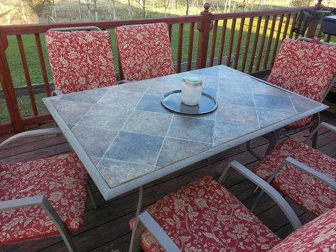 Replacing The Broken Glass on Our Patio Table with a linoleum remnant & plywood - http://fieldsofhether.blogspot.com/2015/05/replacing-broken-glass-on-our-patio.html Glass Patio Table Makeover, Patio Table Makeover, Patio Table Redo, Table Remodel, Glass Patio Table, Tile Patio Table, Crates Ideas, Tile Patio, Housing Decor