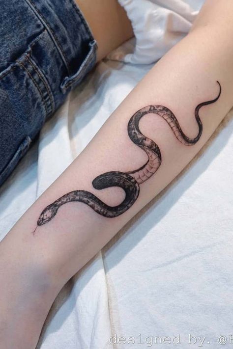 Looking for a snake tattoo idea? Check out these amazing designs that are sure to inspire you. From tribal designs to more intricate patterns, there's something for everyone in this collection. Don't miss out – get inspired today! #snaketattoo #femalesnaketattoo #womansnaketattoo #snaketattoodesign #snaketattooideas #femalesnaketattoo Tato Mandala, Snake Tattoo Meaning, Tato Tradisional, Tattoo Snake, Dragon Sleeve, Snake Tattoo Design, Skeleton Hand Tattoo, Forearm Tattoo Women, E Tattoo