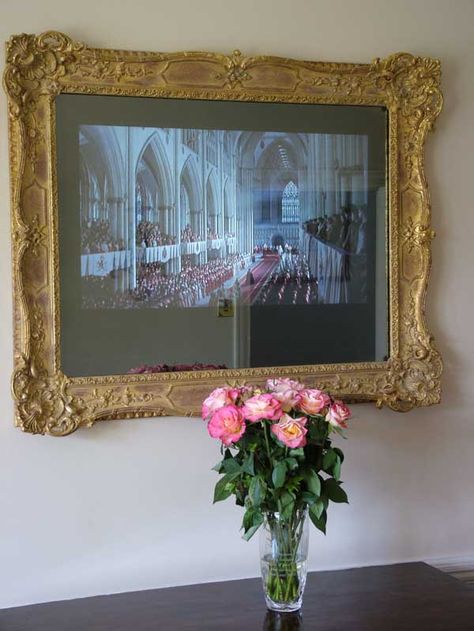 Ornate Regency Swept frame surrounding two way mirrored TV with TV on. Ornate Tv Frame, Samsung Frame Tv With Gold Frame, Gold Framed Tv, Gold Frame Around Tv, Tv With Gold Frame, Vintage Tv Frame, Gold Tv Frame, Tv Gold Frame, Tv Mirror