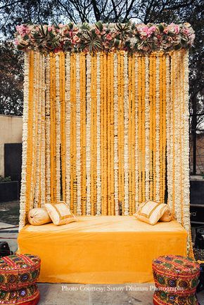 Davina and Nikhil | The Lalit | Chandigarh Wedding | WeddingSutra Sangeet Decorations, Indian Outdoor Wedding Decor, Haldi Decoration Ideas, Haldi Ceremony Decorations, Orange Marigold, Mehendi Decor Ideas, Haldi Decor, White Wedding Decorations, Wedding Hall Decorations