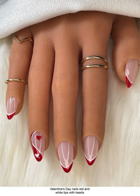 Valentine's Day Nails feature a nude base with white and red tips decorated with hand-painted hearts. Each regular set contains 10 press-on nails.  **Check for your correct nail size as we are not responsible if the wrong size is ordered*** See chart on homepage for size guide.  Alternatively, if you are unsure about your sizing, you can order a full set of 20 nails - 2 of each size or you can order a nail sizing kit.  FAQ:  How long do the nails Almond Nails Red And White, Short Nail Designs Red And White, Red And White Almond Shaped Nails, Red Nails With White Swirls, White Tip Red Heart Nails, Painted Hearts, White Tip, Nail Sizes, Valentine's Day Nails