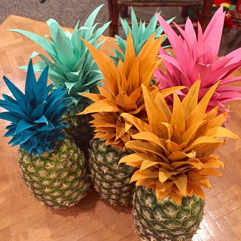 Vibrant painted pineapple centerpieces and decor Centerpieces With Pineapples, Pineapple Vases Centerpiece, Flamingo Party Centerpieces, Hawaiian Table Decorations Centerpieces, Painted Pineapple Centerpiece, Pinapple Party Centerpieces, Hawaiian Gala Theme, Pineapple Table Centerpiece, Tropical Cake Table Decor