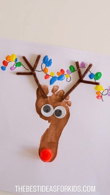 Raindeer Crafts Preschool, Reighndeer Crafts For Kids, Footprint Reindeer Ornament, Foot Print Reindeer Craft, Toddler Christmas Crafts Reindeer, Reindeer Lesson Plans Toddler, Reindeer Feet Craft, Foot Reindeer Craft, Rain Deer Footprint