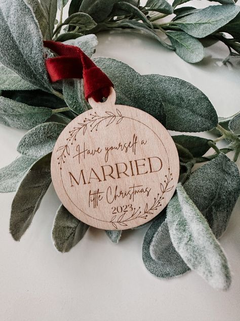 "This listing is for a HAVE YOURSELF A MARRIED LITTLE CHRISTMAS wood ornament Celebrate this special milestone with this first Christmas married ornament! Perfect for adding to your tree this holiday season. | MATERIALS | Each laser cut ornament is approximately 2.5\" in diameter and 1/8\" thick. It's a piece of birch wood that has a hole at the top. They have a rustic looking, burned edge. Each ornament comes with a ribbon (dusty green velvet, burgundy velvet, champagne velvet, or jute twine) o Velvet Christmas Tree Ornaments, Burned Christmas Ornaments, Wood Burning Christmas Gifts, Laser Cut Christmas Gifts, Christmas Engraving Ideas, Christmas Woodburning Ideas, Christmas Personalized Gift, Laser Engraved Ornaments, Christmas Wood Burning Ideas