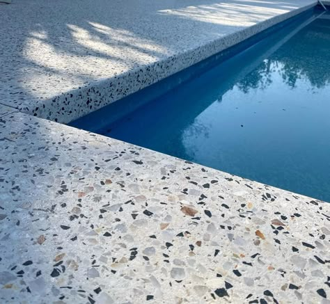 Honed Concrete Pool Surrounds: Combine Luxury and Functionality Exposed Aggregate Pool Surround, Concrete Pool Surround, Terrazzo Pool, Concrete Pool Coping, Concrete Around Pool, Pool Area Landscaping, Exposed Aggregate Driveway, Aggregate Driveway, Honed Concrete