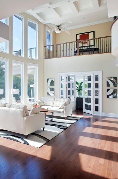 This is a beautiful soaring white coastal style living room with hardwood flooring, view of the upper landing and 2-story windows. 2 Story House Plans, Coastal Style Living Room, Formal Living Room Designs, 2 Story House, High Ceiling Living Room, Cathedral Ceilings, Coastal Living Rooms, Trendy Living Rooms, Living Room Windows