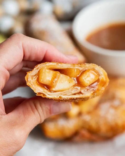 These Apple Pie Egg Rolls are such a fun twist on apple pie, combining juicy apple pie filling with a crispy, crunchy egg roll wrapper. They're a delicious, cozy handheld treat, that is perfect in the fall, and especially delicious served with caramel sauce or whipped cream! Apple Egg Rolls, Juicy Apple Pie, Apple Pie Egg Rolls, Egg Roll Wrapper, Caramel Apples Homemade, No Egg Desserts, Tortilla Rolls, Christmas Cookbook, Apple Pie Filling