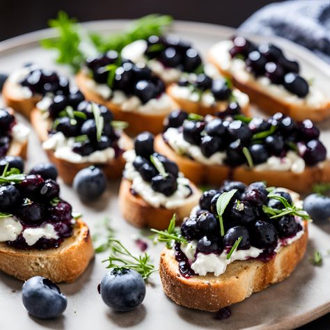 Balsamic Blueberry Goat Cheese Crostinis - Basil & Salt Magazine Whipped Goat Cheese And Blueberry Balsamic Crostini, Balsamic Blueberry Goat Cheese Crostini, Blueberry Balsamic Recipes, Blueberry Vanilla Goat Cheese Recipes, Light Orderves Party Appetizers, Blueberry Goat Cheese Recipes, Blueberry Appetizer Recipes, Blueberry Savory Recipes, Blueberry Lunch Recipes