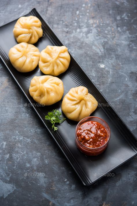 Momos by stockimagefactory. Traditional dumpling momos food from Nepal served with tomato chutney over moody background #Sponsored #dumpling, #momos, #food, #Momos Momo Plating, Momos Plating Ideas, Veg Momos Photography, Momos Menu Design, Momo Food Photography, Momos Food Photography, Momos Picture, Food Photography At Home, Idli Steamer