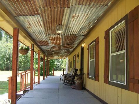 Cover rafters with rusty barn tin to keep birds from roosting and pooping all over the patio Rustic Tin Ceilings, Porch Ceiling Ideas, Barn Tin, Porch Ceiling, Rustic Porch, Ceiling Ideas, Diy Outdoor Decor, Tin Roof, Tin Ceiling