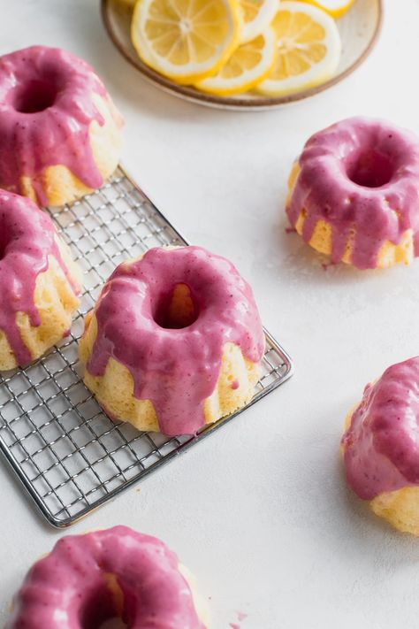 These mini lemon bundt cakes are soft bundt cakes baked in a mini bundt pan. It is topped with a blackberry cream cheese glaze. Tiny Bundt Cakes, Mini Cake Molds, Moist Mini Bundt Cake Recipes, Mini Lemon Cakes, Mini Bundt Cake Recipes, Lemon Bundt Cakes, Blackberry Cream Cheese, Mini Lemon Bundt Cakes, Mini Bunt Cake