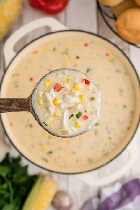 close up of a spoon full of corn and crab bisque above the pot Corn Crab Bisque Recipes, Corn And Crab Bisque Louisiana, Crab Corn Soup, Corn Crab Bisque, Pumpkin Crab Bisque Soup Recipes, Corn And Crab Bisque, Shrimp Crab And Corn Bisque, Book Retreat, Crab And Corn Bisque