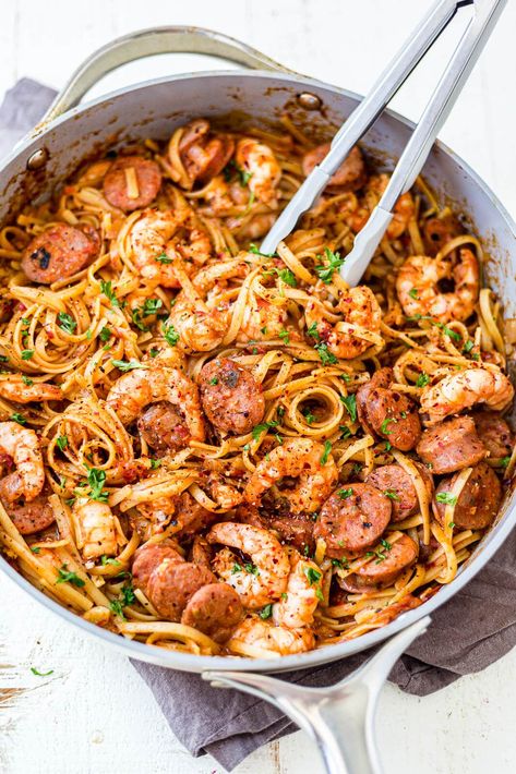 Recipes ⭐️⭐️⭐️⭐️⭐️ One Pot Creamy Cajun Shrimp Pasta  Ingredients For the cajun seasoning: 	•	2 teaspoons smoked paprika 	•	1 teaspoon oregano 	•	1 teaspoon dried thyme 	•	½ teaspoon garlic powder 	•	½ teaspoon onion powder 	•	¼ teaspoon cayenne pepper 	•	¼ teaspoon cumin 	•	¼ teaspoon black pepper 	•	½ teaspoon salt 	•	OR 1 ½ tablespoons cajun seasoning For the pasta: 	•	2 tablespoons olive oil 	•	14 ounces pre-cooked smoked sausage cut into slices (look for no sugar added) 	•	1 medium yellow onion diced 	•	3 cloves garlic minced 	•	12 ounces gluten free (or regular) fettuccine *double check your pasta’s cook time (see notes) 	•	14.5 ounce can fire roasted tomatoes 	•	2 ¼ cups chicken or vegetable broth 	•	1 lb peeled and deveined uncooked shrimp 	•	½ cup coconut cream (sub heavy cream or Healthy Meals With Noodles, Easy Recipes Dinner Dairy Free, Easy Dairy Free Meals Dinners, Best Dairy Free Dinner Recipes, Weeknight Dinner Dairy Free, Gluten Free And Dairy Free Dinner Ideas, Easy Dinner Recipes Non Dairy, Paleo Pasta Recipes, Easy Dinner Recipes Lactose Free