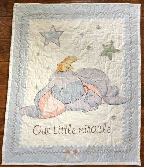 This Disney Dumbo Our Little Miracle blanket/quilt ships anywhere in United States This blanket includes 3 layers. Top layer is the Disneys Dumbo Our Little Miracle panel. Center is quality cotton batting and binding and backing are with coordinating 100% cotton fabric with wavy Dumbo Nursery, Nursery Disney, Baby Dumbo, Disney Bedding, Elephant Nursery Decor, Dumbo The Flying Elephant, Girl Nursery Bedding, Disney With A Toddler, Trendy Baby Nursery