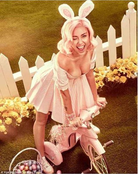 Beaming: The 25-year-old singer pretending to be spanked by the Easter bunny in one racy shot, before flaunting her cleavage in a very low-cut dress Miley Cyrus Photoshoot, Somebunny Loves You, Easter Photoshoot, Low Cut Dresses, Easter Photos, Aesthetic Outfit Ideas, Easter Outfit, Bunny Ears, Vogue Magazine