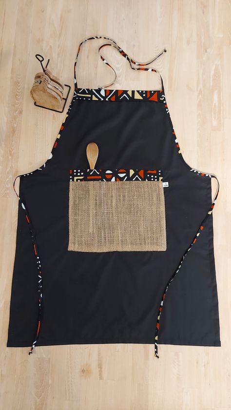 Bogolan rustic Apron with african print detail and a burlap pocket Shweshwe Aprons, African Cutlery, Ankara Kitchen Aprons, Zimbabwean Traditional Fabric, African Fabric Accessories, Traditional Aprons, Traditional Brown Ankara Fabric, African Shop, Apron Design