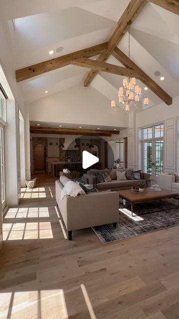 Davies Design Build on Instagram: "The living room at our Crimson Oak project is truly the heart of the home.   Video: @paradeofhomesig @lindy.denny Design: @designwithmaven with @manifoldinteriordesign  Beams: @earthandstonedesign  Trim work: @awesometrimwork  Stone: @beehivebrickandstone  Featured in @uvparade   #daviesdesignbuild #buildwithdavies #residentialinteriors #residentialdesign #homeinspiration #homeinspo #homestyle #instahome #instahomes #instaluxe #luxuryhome #luxuryhomes #luxuryhomebuilder #luxuryinteriors #luxedesign #beautifulhomes #beautifulhome #ighome #interiorarchitecture #myhomesense #houseandhome #homedesign  #homedesignideas #homedesigns" Living Room Beams, Hampton Kitchen, Trailer Makeover, Trim Work, Home Video, Living Room Area, Residential Design, Luxury Interior, New Construction