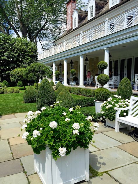 At Home in the Garden via Quintessence Carolyn Roehm, Manicured Garden, Carolyne Roehm, Brick Chimney, Flagstone Patio, Porch Railing, Garden Swing, Beautiful Outdoor Spaces, Diy Garden Furniture