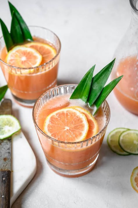 Transport yourself straight to a tropical island with this guava cocktail spiked with pineapple-infused rum! It's sweet, tangy, refreshing and always a hit at parties and holidays. #guavacocktail #tropicalcocktail #rumcocktail #cocktailrecipes #craftcocktails #infusedalcohol #infusedrum #pineappleinfusedrum | crowdedkitchen.com Guava Cocktail, Cocktail Recipes Tequila, Mango Rum, Crowded Kitchen, Rum Cocktail Recipes, Guava Juice, Pineapple Rum, Homemade Cocktails, Rum Cocktail