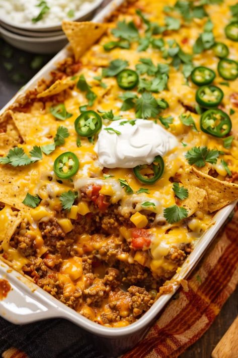 "Try our easy and delicious Walking Taco Casserole, made with layers of seasoned ground beef, cheese, and crispy tortilla chips. Perfect for family dinners! #tacotuesday #casserole #familydinner" Taco Meat Rice Casserole, Queso Casserole Ground Beef, Beef And Bean Taco Casserole, Taco Crunch Wrap Casserole, Tortilla Chip Casserole Beef, Easy Taco Casserole Recipes, Taco Casserole Bake With Tortillas, Taco Pie With Tortillas, Mexican Casserole With Beef