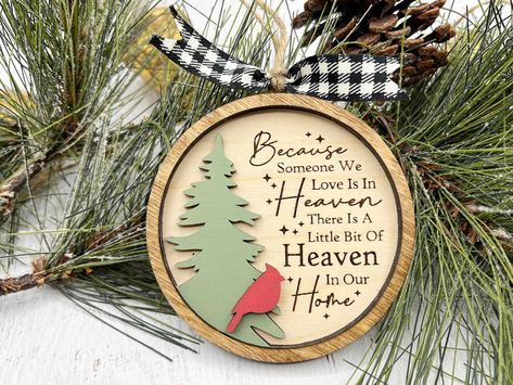 This Christmas in Heaven ornament will make such a special addition to your Christmas tree.  This makes a great memorial gift. I T E M   I N F O R M A T I O N  Ornament measures 4" wide x 4.4" high Laser engraved and cut on Baltic Birch. Due to the custom nature of wood, each ornament may vary slightly in appearance making each truly unique and beautiful. In Memory Of Ornaments, In Memory Ornaments, Laser Ornaments, Memorial Christmas Ornaments, Christmas In Heaven Ornament, Heaven Ornament, Mom Memorial, Cardinal Christmas, Embroidery Hoop Crafts