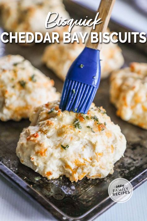 These Bisquick Cheddar Bay Biscuits are a Red Lobster classic made right at home! These Homemade Cheddar Bay Biscuits are light, fluffy, crispy on the edges, loaded with shreds of sharp cheddar cheese, and topped with a 3-ingredient garlic herb butter that just takes them over the top! This Cheddar Bay Biscuit Recipe is incredibly simple, but yields the most delicious side dish. Serve these Cheddar Bay Biscuits with Bisquick alongside any of your favorite comforting dinners. Cheddar Bay Biscuits With Bisquick, Cheddar Bay Biscuits Bisquick, Bisquick Cheddar Biscuits, Biscuits With Bisquick, Red Lobster Copycat, Garlic Cheddar Biscuits, Bisquick Biscuits, Cheddar Cheese Biscuits, Red Lobster Cheddar Bay Biscuits