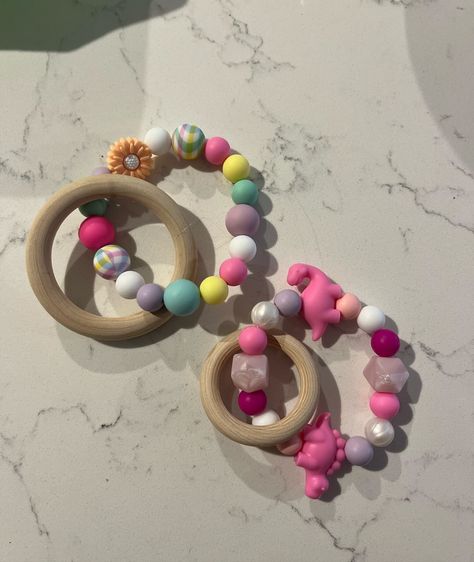 Size comparison between our large teething ring and small teething ring! 🫶🏻 Not only does the large teething ring have a bigger sized beechwood ring but also more space for beads! 🙌 My little one personally likes to wear the beads on her hand and chew on the beech wood, she’s fashionable like that😂 Check out our dummy chain and teething ring price list for information and deals, message to order💖 #teethingring #babyteething #teether #babyteeth #teethinghack #teethinghelp #beechwoodteether... Teething Hacks, Dummy Chain, Teething Ring, Size Comparison, Baby Teeth, Price List, Beech Wood, Little One, Beads