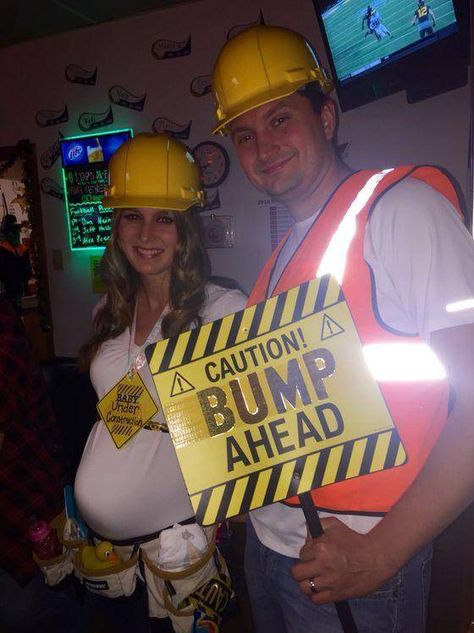 23 Funny Pregnant Halloween Costumes That Are Really Clever Bump Ahead Halloween Costume, Construction Family Costume, Halloween Costume Pregnancy Announcement, Halloween Costumes For Pregnant Couples, Pregnancy Announcement Halloween Costume, Remi Costume, Halloween Pregnancy Announcement Costume, Pregnant Halloween Costumes Family, Cute Pregnant Halloween Costumes