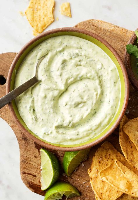 This easy cilantro lime crema adds zesty flavor to tacos, burritos, grilled veggies, and more! It's made with simple, healthy ingredients like Greek yogurt, garlic, fresh cilantro, and lime juice. Cilantro Lime Crema Recipe, Lime Crema Recipe, Cilantro Lime Crema, Crema Recipe, Lime Crema, Grilled Sweet Potatoes, Zesty Sauce, Taco Salad Recipes, Cilantro Lime Dressing