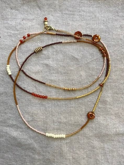 Beautiful, one of a kind, extra long, single-strand wrap beaded necklace. Handmade with an artfully chosen, unique mix of oranges and pinks: carnelian, Czech glass, and seed beads, with gold-plated findings. Can be worn many different ways; single, double, or triple wrapped, and even as a multi wrap bracelet. You can spin it around to highlight different stones or colors.  Great worn alone, but also super fun when layered with more necklaces; either another one from our collection, or your own t Boho Beads Necklace, Long Seed Bead Necklace, Beading Necklace, Jewelry Shop Display, Jewellery Beads, Multi Wrap Bracelet, Diy Necklaces, Wrap Necklace, Beaded Jewelry Designs