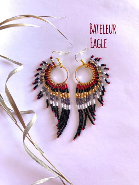 "Handmade, lightweight, durable, beaded dangle earrings. For bird, raptor, and falconer enthusiasts! Bird type: Bateleur Eagle. Native to Africa! Size: Medium hoop size, and just over 3.5 inches total length from hook to end of the longest beaded strand. Hoop size: Medium: 20mm (0.8 inches) Materials: Silver hooks, with White K hoops. Made with glass beads, 6lb mirco-infused Fireline thread, glue, and rubber earring backing. Care instructions included. Processing: Please allow 1-3 days for processing. Shipping: Sent USPS Ground. Delivery time depends on your location. Returns: You may return your item as long as you pay for return shipping. A full refund will be given if the jewelry is returned in the same condition when purchased.  40% of every raptor related sale is donated to the Rocky Native Beaded Jewelry, Beaded Earrings Patterns Free, Handmade Earrings Ideas, Bateleur Eagle, Beaded Feather Earrings, Native Beaded Earrings, Beaded Feather, Seed Bead Jewelry Patterns, Beaded Jewelry Earrings