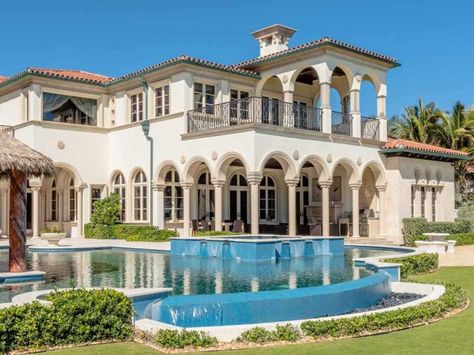 Artful columns and arches overlook an infinity edge pool. Mansion Background, Mediterranean Pool, Beach Mansion, Luxury Mansions, Exterior Houses, Stone Exterior, Palm Beach Style, Spa Rooms, Infinity Edge Pool