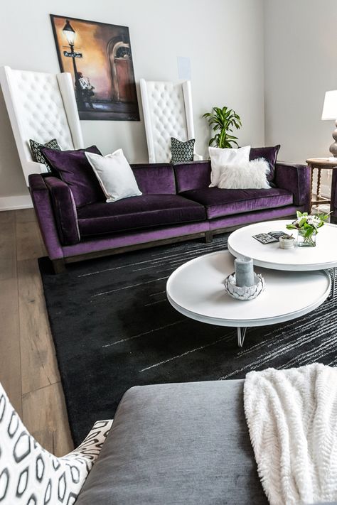 Henck Design's client wanted a home inspired by the vibrant city of New Orleans. For this contemporary living room, we paired purple velvet sofas, tufted leather chairs with a modern black rug, a set of simple white nesting coffee tables and minimal accessories to keep this interior design boldly sophisticated. Purple Velvet Sofa, Purple Interior Design, Purple Furniture, Purple Couch, Purple Living Room, Velvet Sofas, Purple Sofa, Interior Design Minimalist, Gem Tones