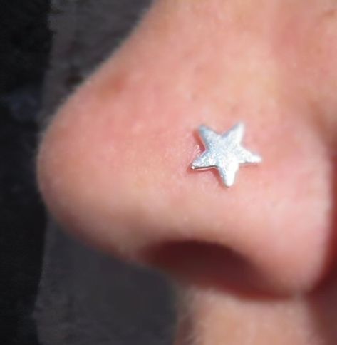 These sweet little studs have a fine silver star on a sterling silver post,  The largest star measures approximately 5mm across, the smallest is approximately 2mm. Its post is 0.80mm diameter.  They come with a hook or coil, please choose from drop down menu.   The hook is bent to a right angle in the middle of the 9.5mm post to fit in your nose, but if you would like it straight to bend yourself just choose that option.  The coil can be bought for a left or right nostril .  We also do moons, fo Star Stud Nose Piercing, Star Nostril Piercing, Cool Nose Piercings, Nose Pericings, Piercings Nose Stud, Star Nose Piercing, Star Nose Ring, Nose Piercing Nostril, Star Nose Stud