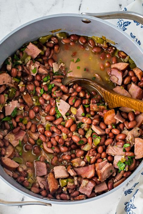 Easy Red Beans and Rice is flavorful Cajun dinner! Tender red beans with sausage, ham, and a bounty of savory Southern seasonings. Easy Red Beans And Rice With Sausage, Red Beans And Ham Hocks, Red Beans With Ham Hock, Red Beans And Rice With Ham Hock, Cajun Beans And Rice, Red Beans And Ham, Rope Sausage Recipes, Southern Seasonings, Easy Red Beans And Rice