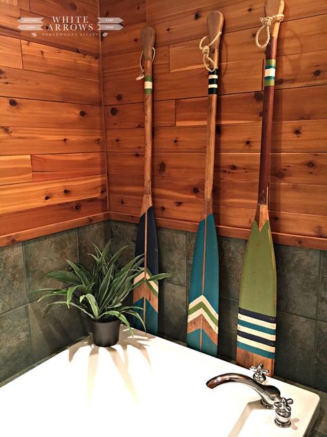 Lake House Style- Nautical Bathroom Makeover - #blog #decorating #home-tour #northwoods-living #blog #decorating #home-tour #northwoods-living River House Decorating Ideas, Log Cabin Bathroom, Painted Oars, Paddle Decor, Painted Paddles, Lake House Bathroom, Bath Paint, Cabin Bathroom, Nautical Bathroom