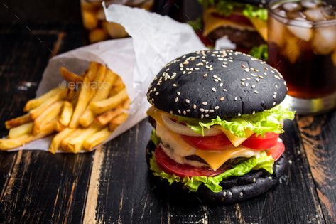 Black burger by its_al_dente. Black burger with meat patty, cheese, tomatoes, mayonnaise, french fries in a paper cup and glass of cold cola soda w... #Sponsored #cheese, #patty, #mayonnaise, #tomatoes Pizza Photography Ideas, Fast Food Catering, Charcoal Burger, Vogue Food, Goth Food, Burger Images, Charcoal Food, Black Burger, Mini Burger