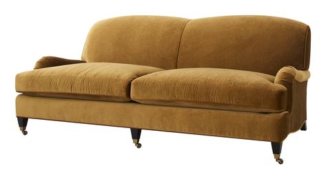 Casual with a hint of classic, our transitional Morgan Sofa mixes well with just about any décor. With a low profile, deep seat cushions and a perfectly pitched firm back, it really is as comfy as it looks. English-style rolled arms and antique brass casters bring a traditional touch to Morgan's rounded silhouette. Relaxed enough for the family room, our timeless Morgan can also be dressed up with a striking cocktail table and luxe pillows. As Shown •upholstered in tulum gold velvet •fabric cont Bullion Fringe Sofa, Mohair Couch, English Roll Arm Sofa Living Room, Camel Velvet Sofa, English Rolled Arm Sofa, Luxe Pillows, English Arm Sofa, Unique Couches, Profile Deep