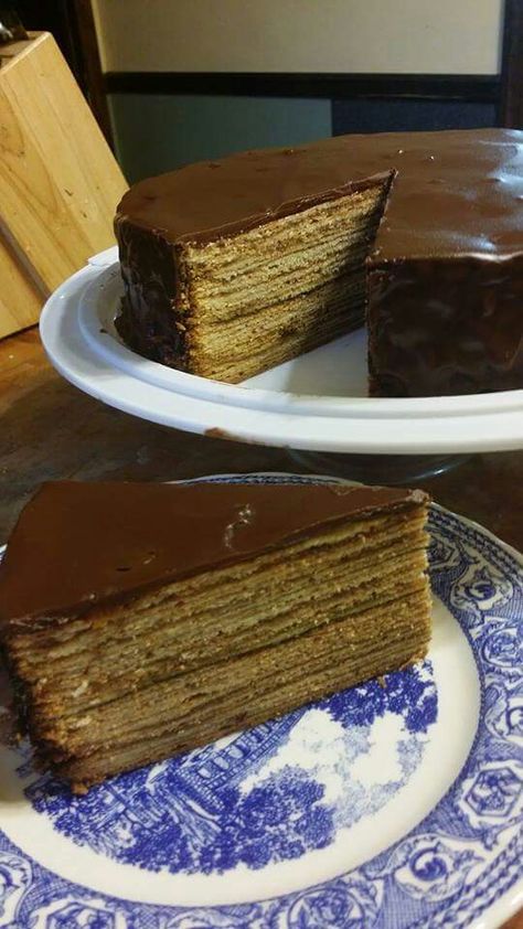 Baumkuchen All ingredients should be room temperature Cake: 1 1/2 cups almond paste, tightly packed (12 oz) 6 Tbsp half & half 1 1/2 sticks butter, softened 1 cup sugar 10 eggs, separated 1 1/2 tsp vanilla extract 1 cup cake flour 3/4 cup cornstarch ½ teaspoon salt 10 oz jar plum or apricot jam 2 tablespoons butter, melted for pan Chocolate Glaze: 6 Tbsp butter 2 Tbsp rum 1 Tbsp vanilla extract 3 Tbsp light corn syrup 6 oz semi-sweet chocolate chips In the bowl of a standing mixer fitted with th Grandma Chocolate Cake, Seven Layer Chocolate Cake, 15 Layer Chocolate Cake Recipe, Cooked Chocolate Icing Old Fashioned, Boiled Chocolate Icing Old Fashioned, 7 Layer Chocolate Cake, Boiled Chocolate Icing, 12 Layer Chocolate Cake Recipe, Layer Chocolate Cake Recipe