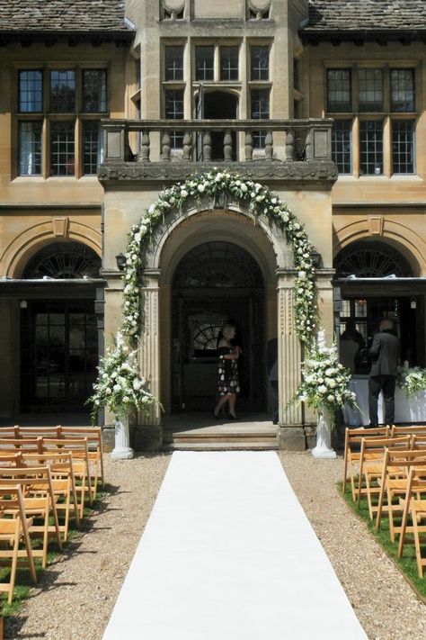 Archway and urn arrangements at coombe lodge in the outside ceremony area Isle Flowers, Coombe Lodge, Fiesta Flowers, Outside Ceremony, Urn Arrangements, Wedding Isles, 2015 Wedding, Travel Theme Wedding, Venue Decorations