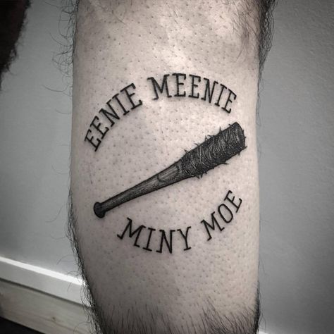 Eenie Meenie Miny Moe and a spiked club inked on the calf Lucille Tattoo, Walking Dead Tattoo, Apocalypse Tattoo, Zombie Tattoos, Bat Tattoo, Pin Up Tattoos, B Tattoo, Tattoos For Daughters, S Tattoo