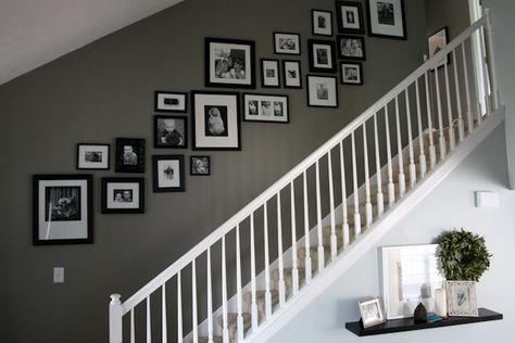 This is exactly what I want to do going up our stairs. Except, I'll mix color and bw photos like on the wall behind my couch. Stairway Photo Wall, Pictures On Stairs, Photo Wall Design, Stairway Photos, Stair Walls, Picture Arrangements, Casa Clean, Stair Wall, Staircase Wall