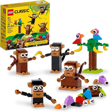 Jungle animal toy – LEGO Classic Creative Monkey Fun (11031) is packed with hands-on play possibilities to engage, entertain and inspire kids Ages 5 and up. Lovable characters – Kids assemble 4 monkeys using an assortment of bricks, expressive eye decorations and smile/frown tiles. The set also includes 4 bananas, 2 buildable birds and a buildable tree. Eye Decorations, Lego City Police, Best White Elephant Gifts, Monkey Gifts, Kids Create, Buy Lego, Lego Creator, Cute Monkey, Building For Kids